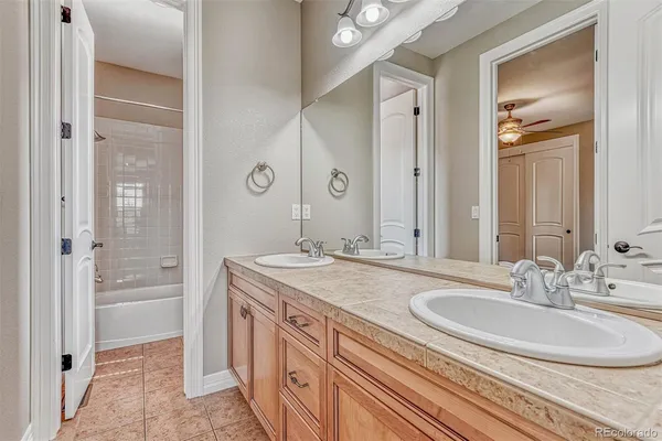 a bathroom with a sink double vanity and a mirror