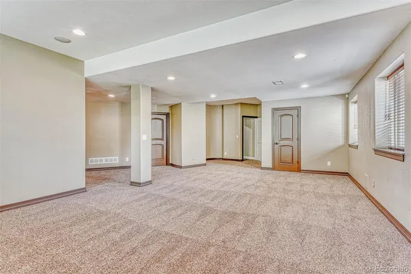 a view of an empty room and window