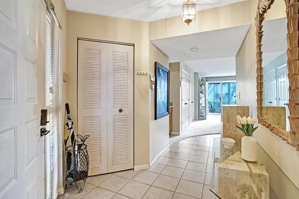 a view of living room kitchen and stainless steel appliances