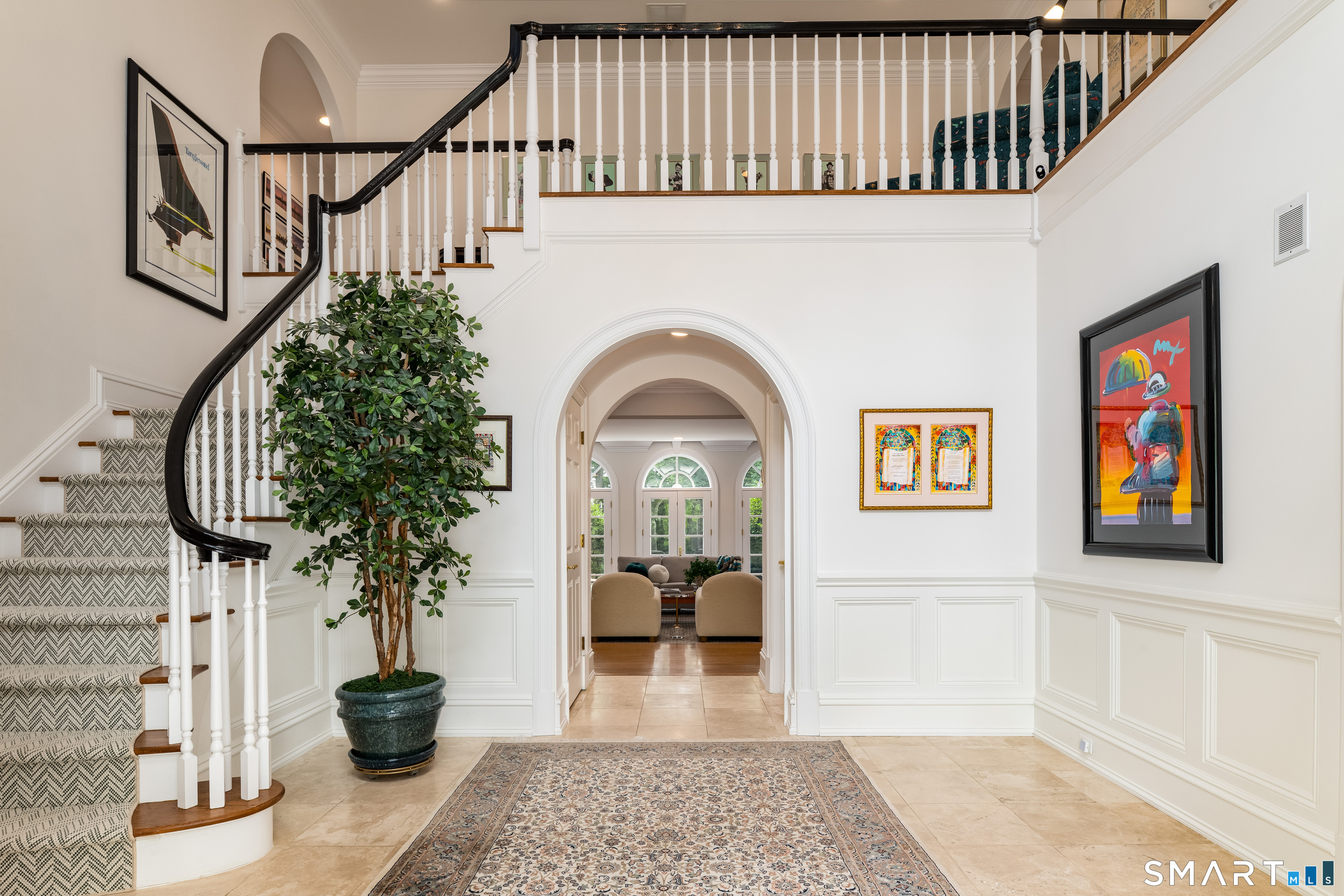 760 Smith Ridge Road New Canaan, CT 06840 - Photo 2 of 40 a view of a hallway with wooden floor and entryway