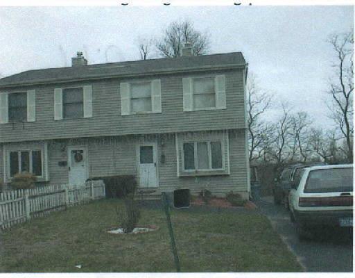 a front view of a house with outdoor space