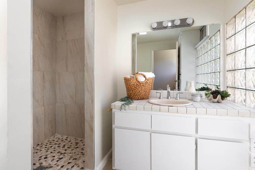96 Wheelock Road Watsonville, CA 95076 - Photo 18 of 53 a bathroom with a sink and a mirror