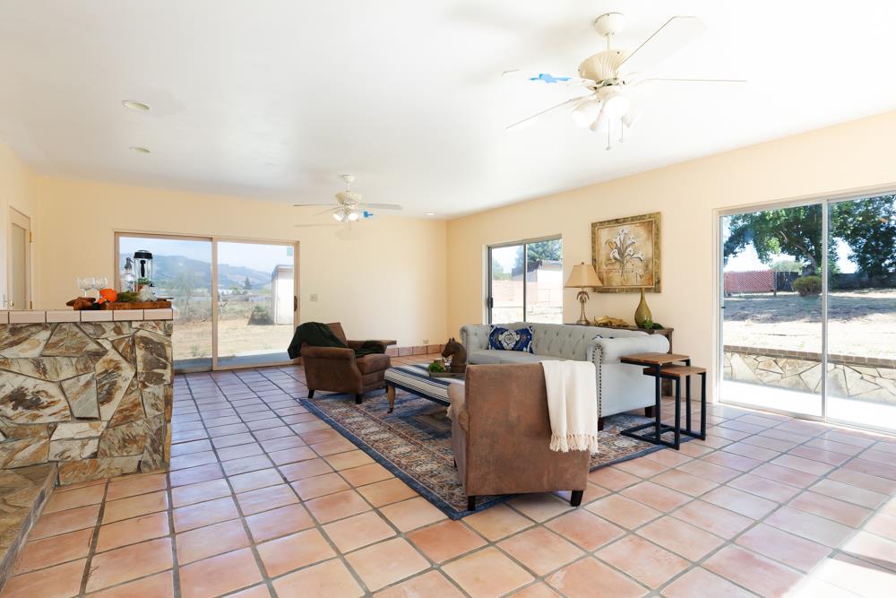 96 Wheelock Road Watsonville, CA 95076 - Photo 6 of 53 a living room with furniture and a flat screen tv