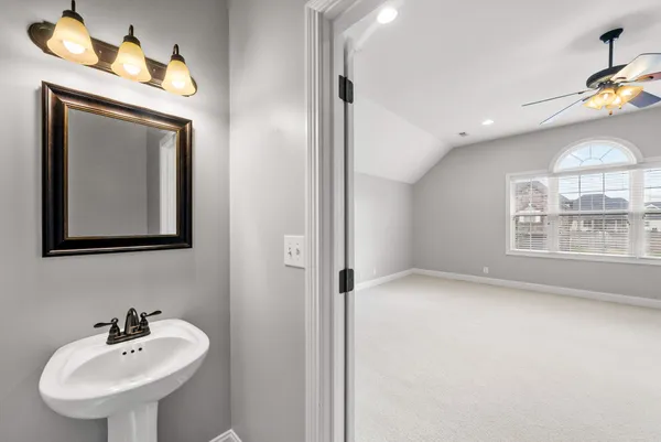 a picture of a bathroom with a sink and mirror
