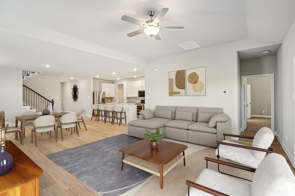 2621 Grand Cyn Street Anna, TX 75409 - Photo 11 of 37 a living room with furniture kitchen view and a chandelier