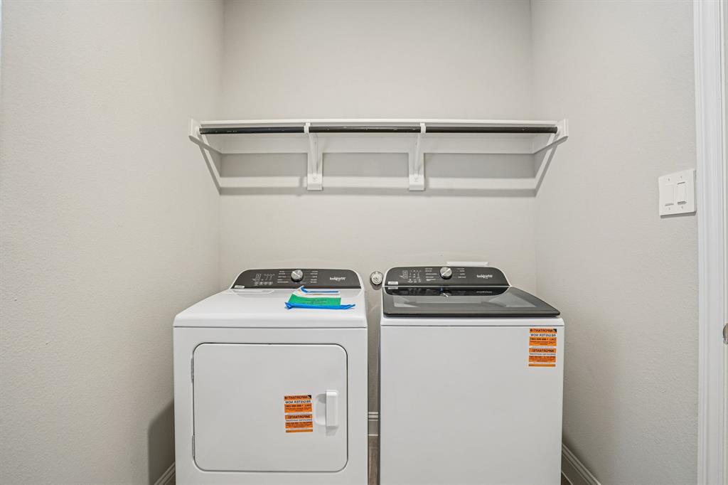 2621 Grand Cyn Street Anna, TX 75409 - Photo 17 of 37 a utility room with dryer and washer