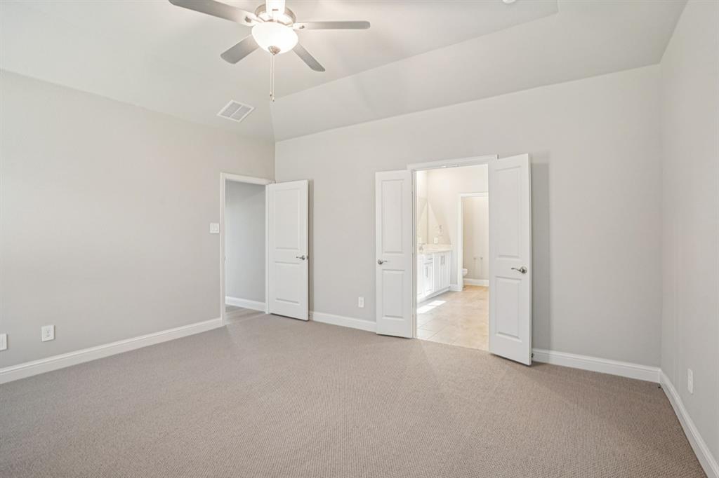 2621 Grand Cyn Street Anna, TX 75409 - Photo 19 of 37 an empty room with chandelier fan and closet area