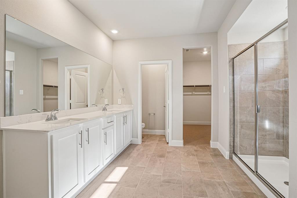 2621 Grand Cyn Street Anna, TX 75409 - Photo 20 of 37 a bathroom with a double vanity sink mirror and double
