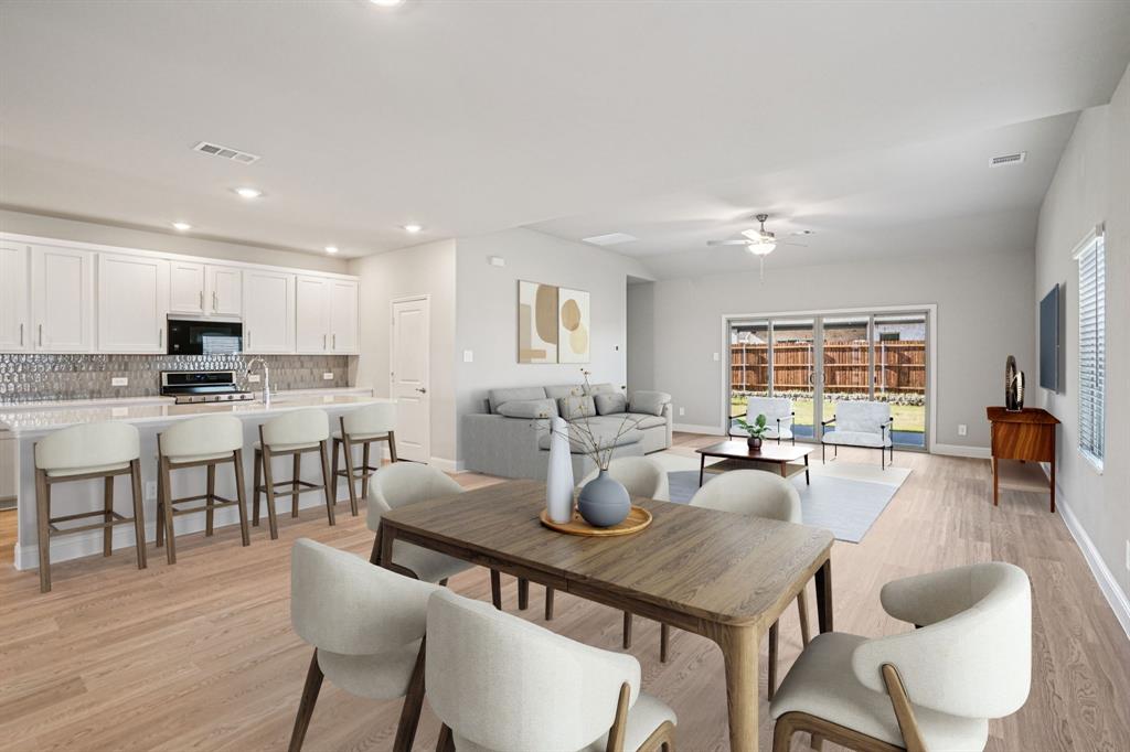 2621 Grand Cyn Street Anna, TX 75409 - Photo 4 of 37 a large kitchen with a table and chairs