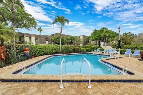 a view of a swimming pool with a patio