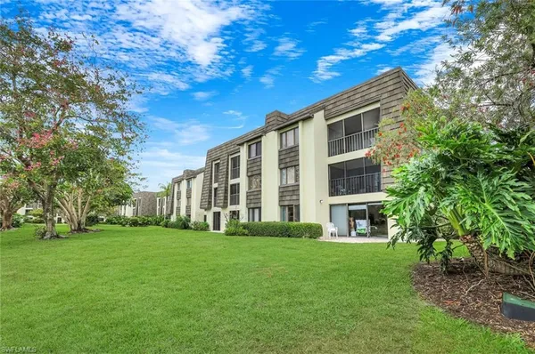 a view of a golf course with a lake