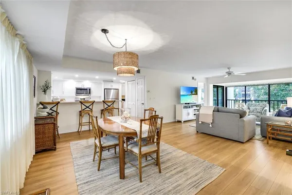 a view of a dining room with furniture and wooden floor