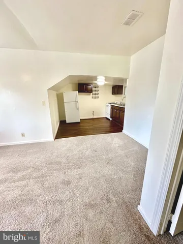 a view of a bedroom with a bed and cabinets