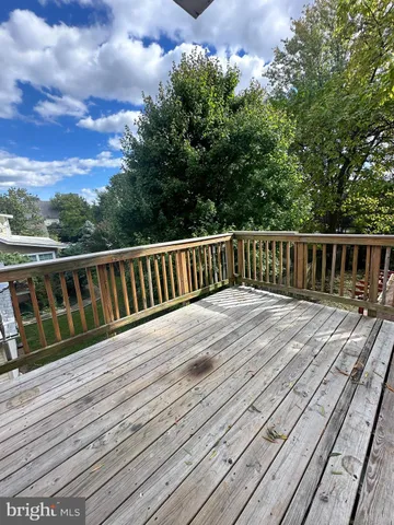 a balcony with wooden floor