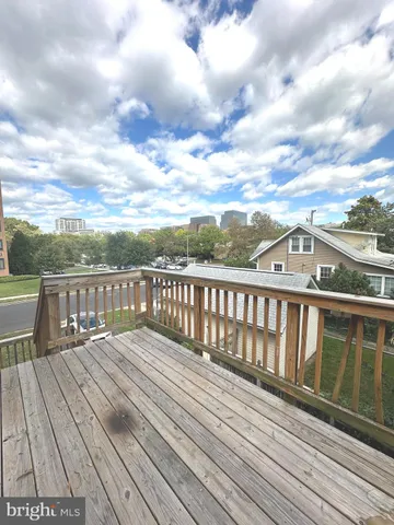 a view of deck with wooden floor and fence