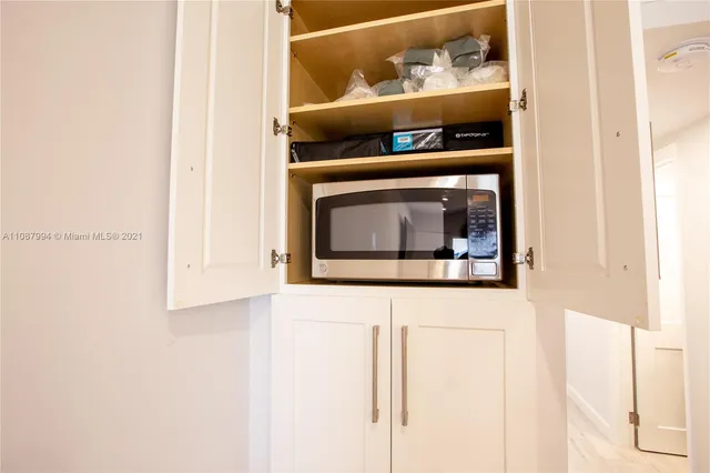 a living room with washer and dryer