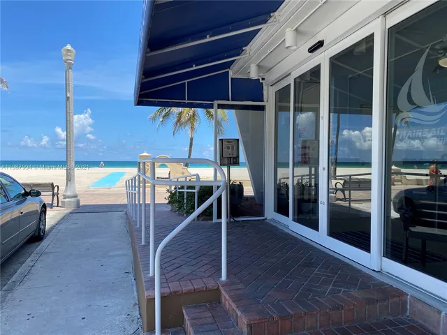 a view of a balcony with palm trees