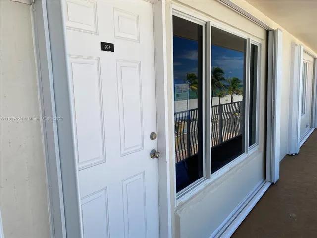 a view of a swimming pool with lounge chair
