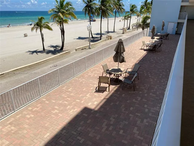 a view of a swimming pool and a chairs