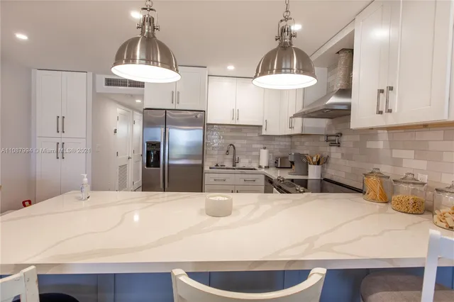 a kitchen with counter space and stainless steel appliances