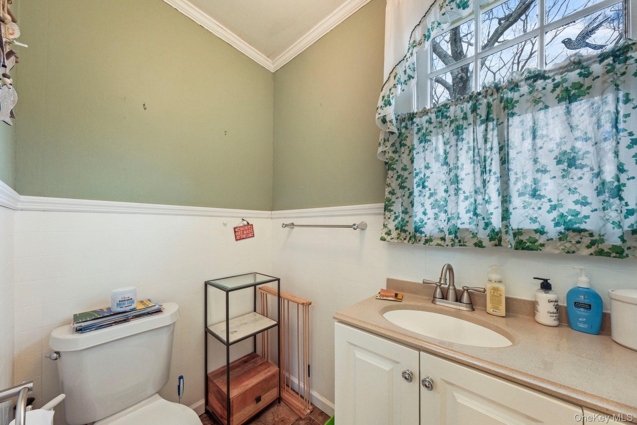 184 Yankee Lake Road Wurtsboro, NY 12790 - Photo 15 of 27 Bathroom featuring vanity and crown molding