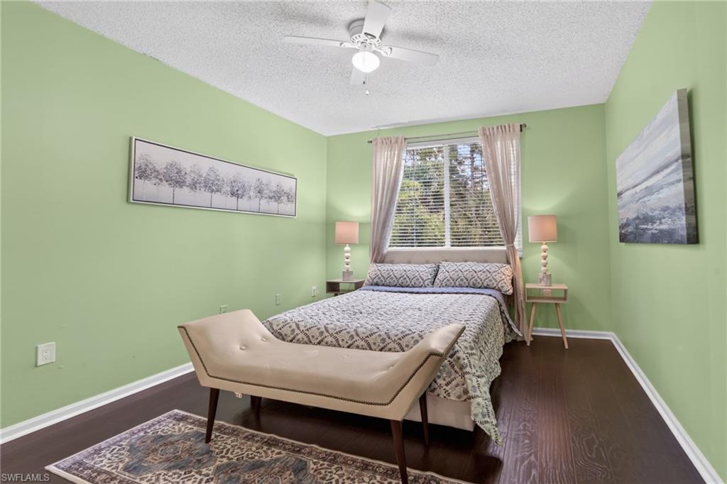 1105 Reserve Court, Unit 206 Naples, FL 34105 - Photo 7 of 23 a bedroom with a bed and a window