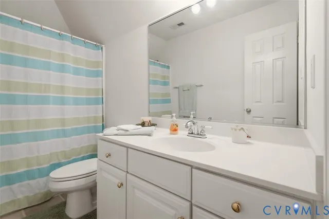 a view of a house with wooden deck