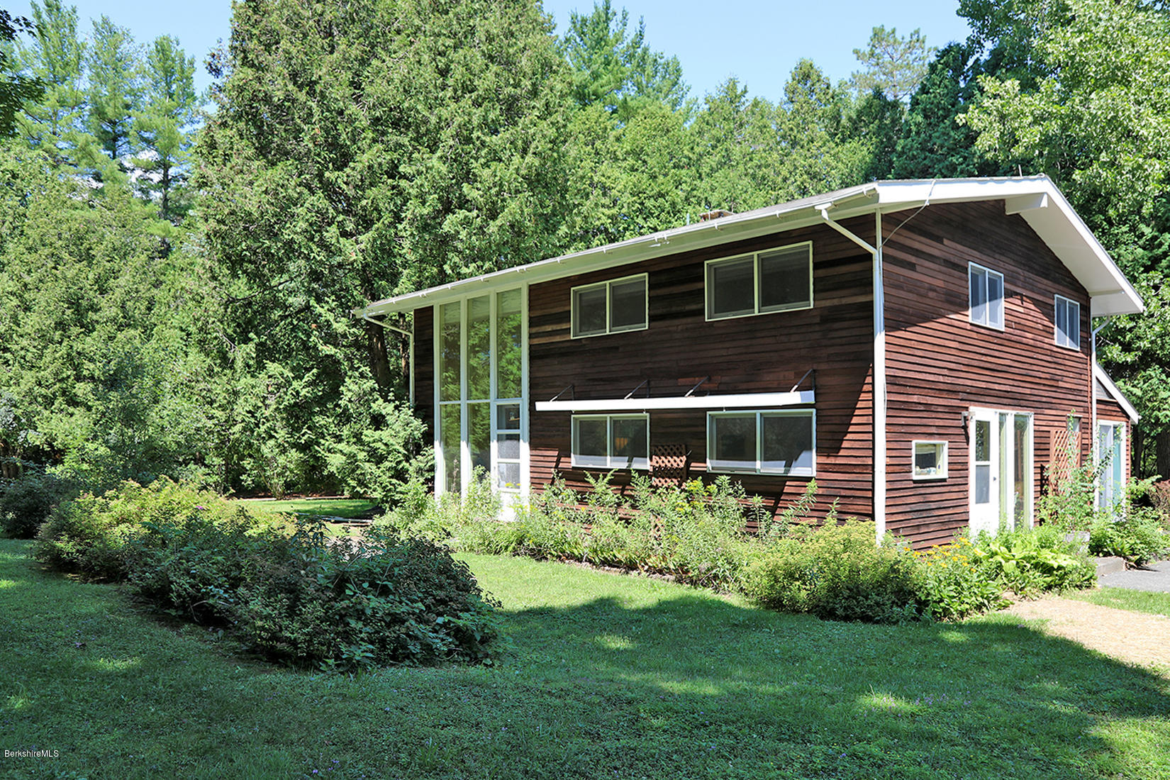 13 Hill Road Stockbridge, MA 01262 - Photo 1 of 27 a front view of house with yard and green space
