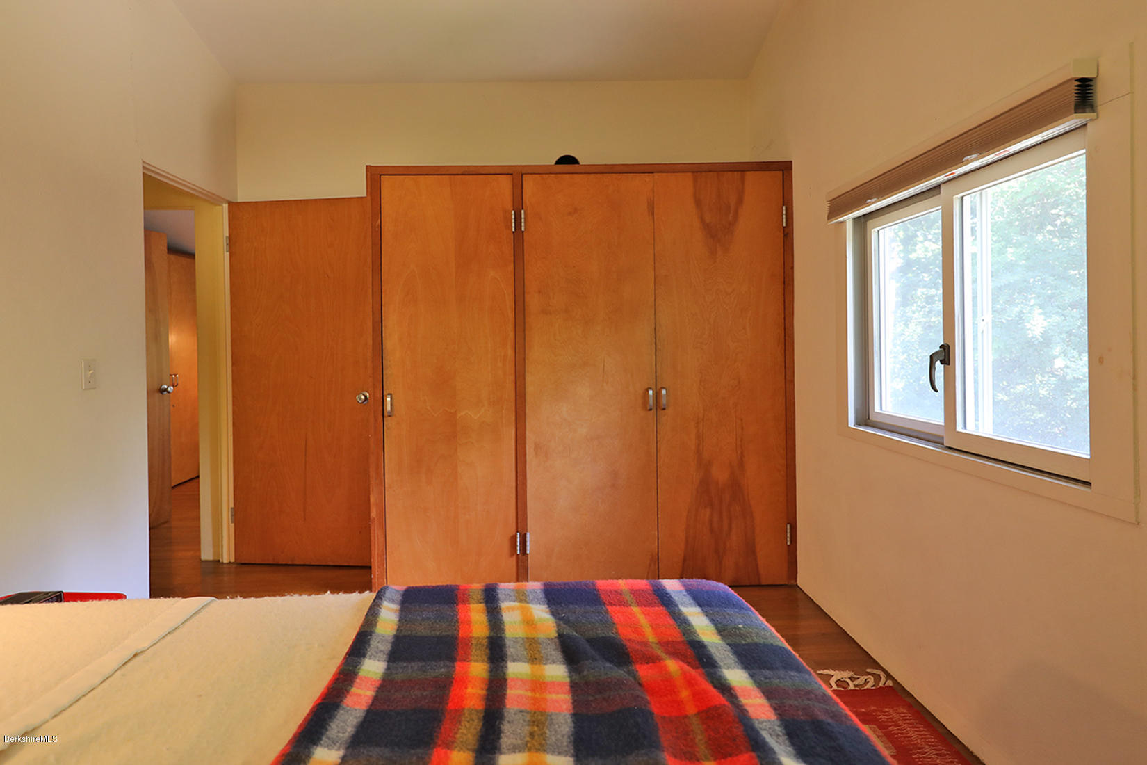 13 Hill Road Stockbridge, MA 01262 - Photo 23 of 27 a bedroom with a bed and a window