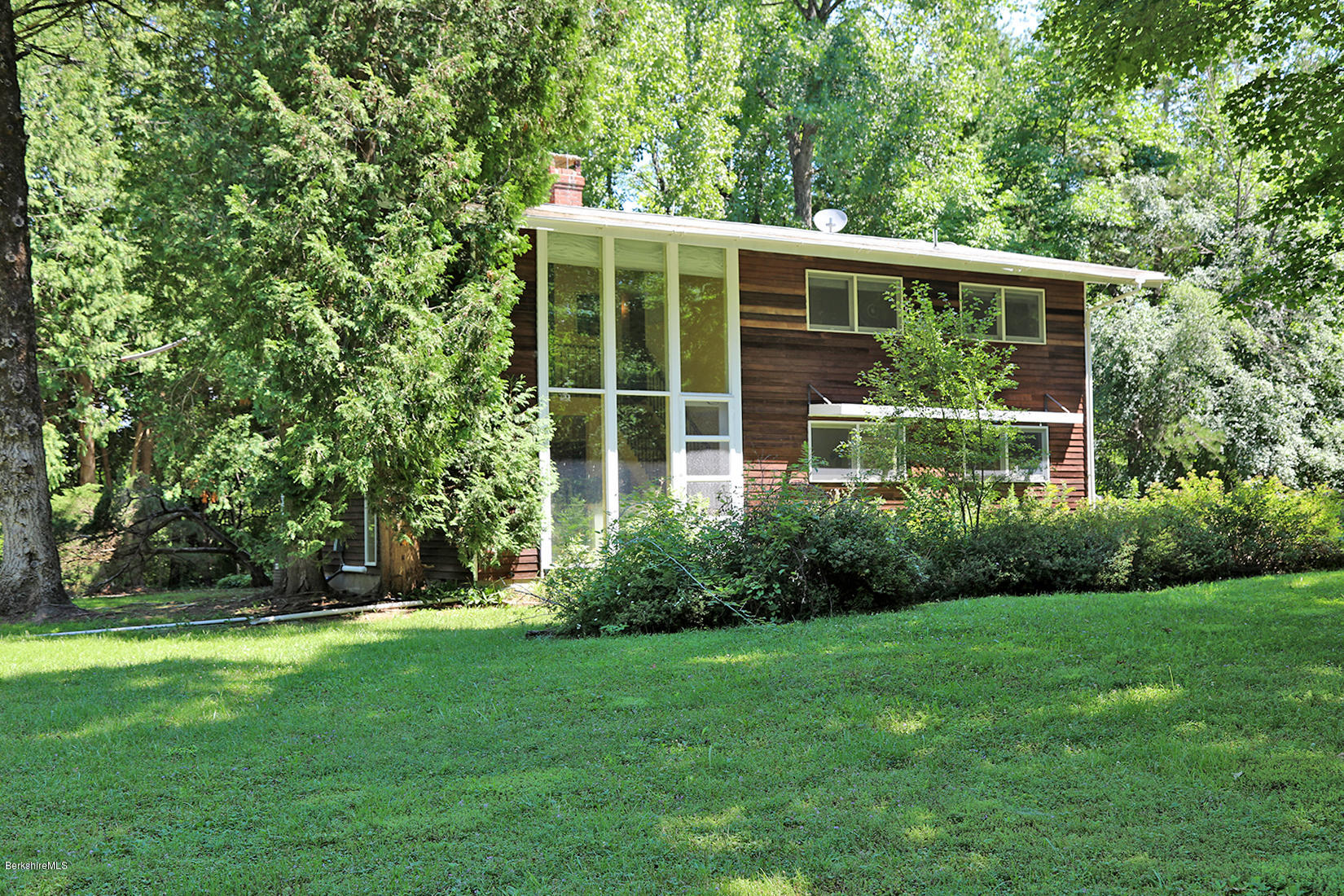 13 Hill Road Stockbridge, MA 01262 - Photo 27 of 27 a house with a tree in front of it
