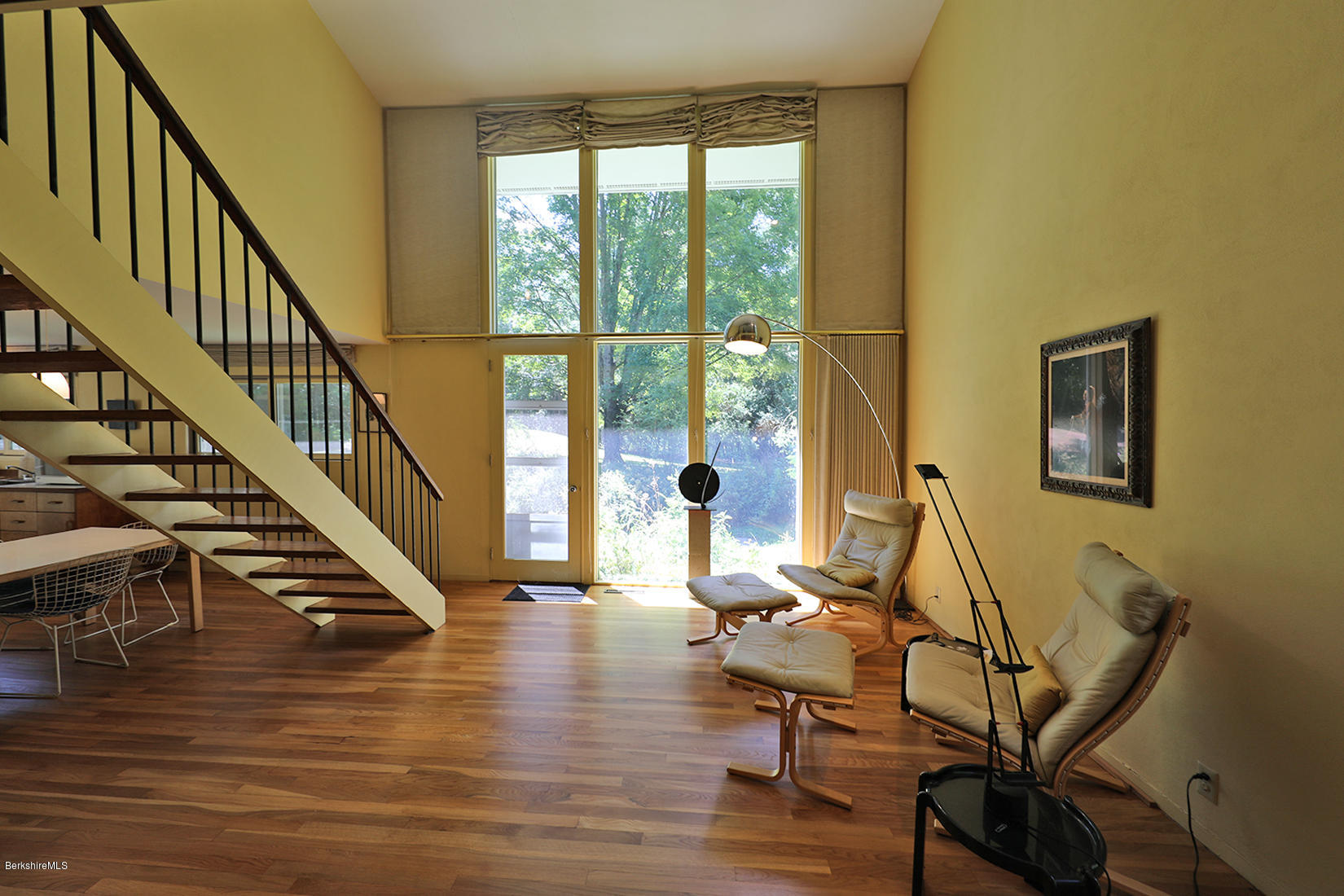 13 Hill Road Stockbridge, MA 01262 - Photo 4 of 27 a view of a livingroom with wooden floor windows and stairs