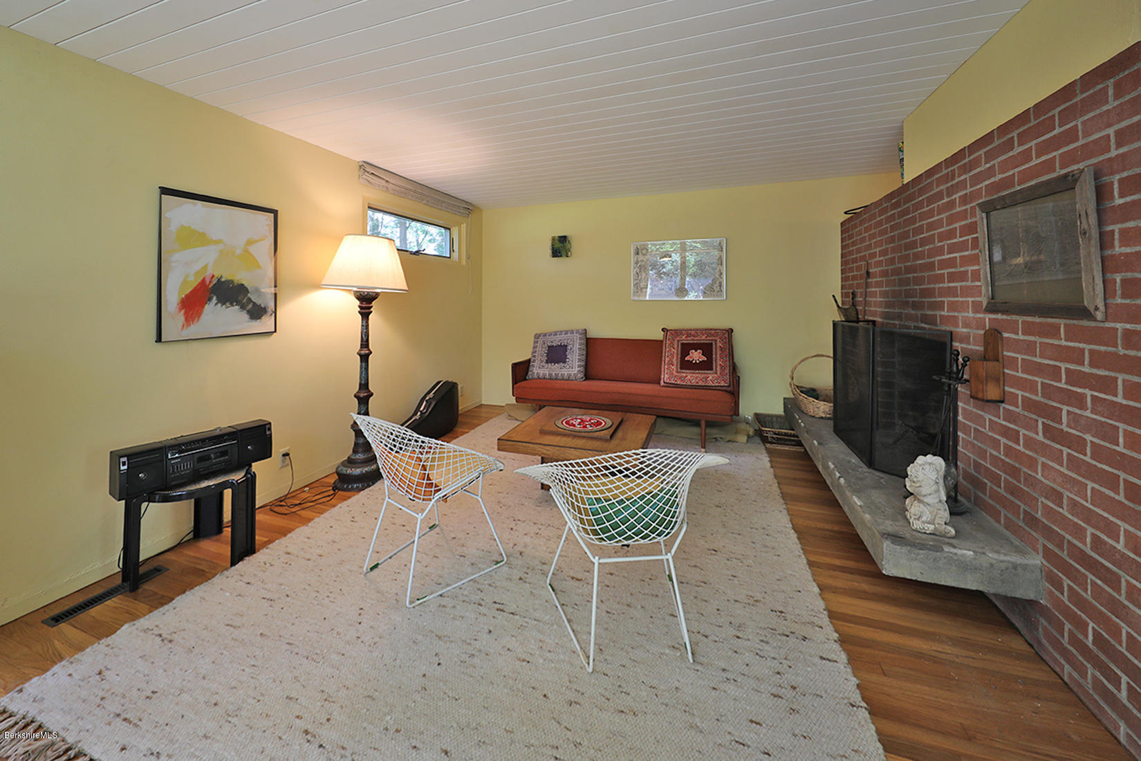 13 Hill Road Stockbridge, MA 01262 - Photo 6 of 27 a living room with furniture a window and a fireplace