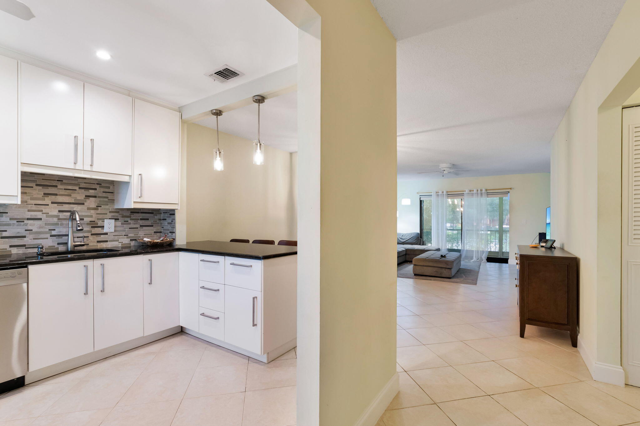 1700 Dover Road, Unit 204A Delray Beach, FL 33445 - Photo 11 of 33 a spacious bathroom with a granite countertop sink a mirror and a bathtub