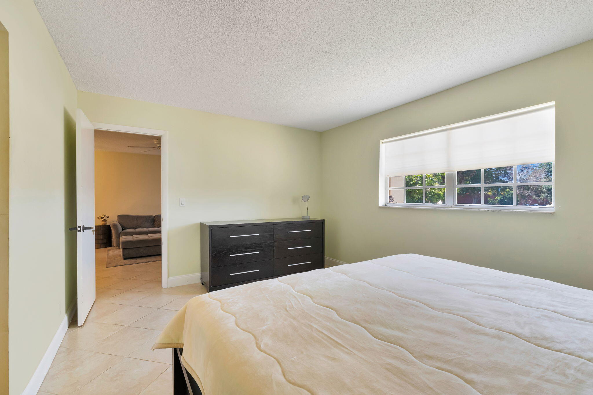 1700 Dover Road, Unit 204A Delray Beach, FL 33445 - Photo 14 of 33 a bedroom with a bed and a window