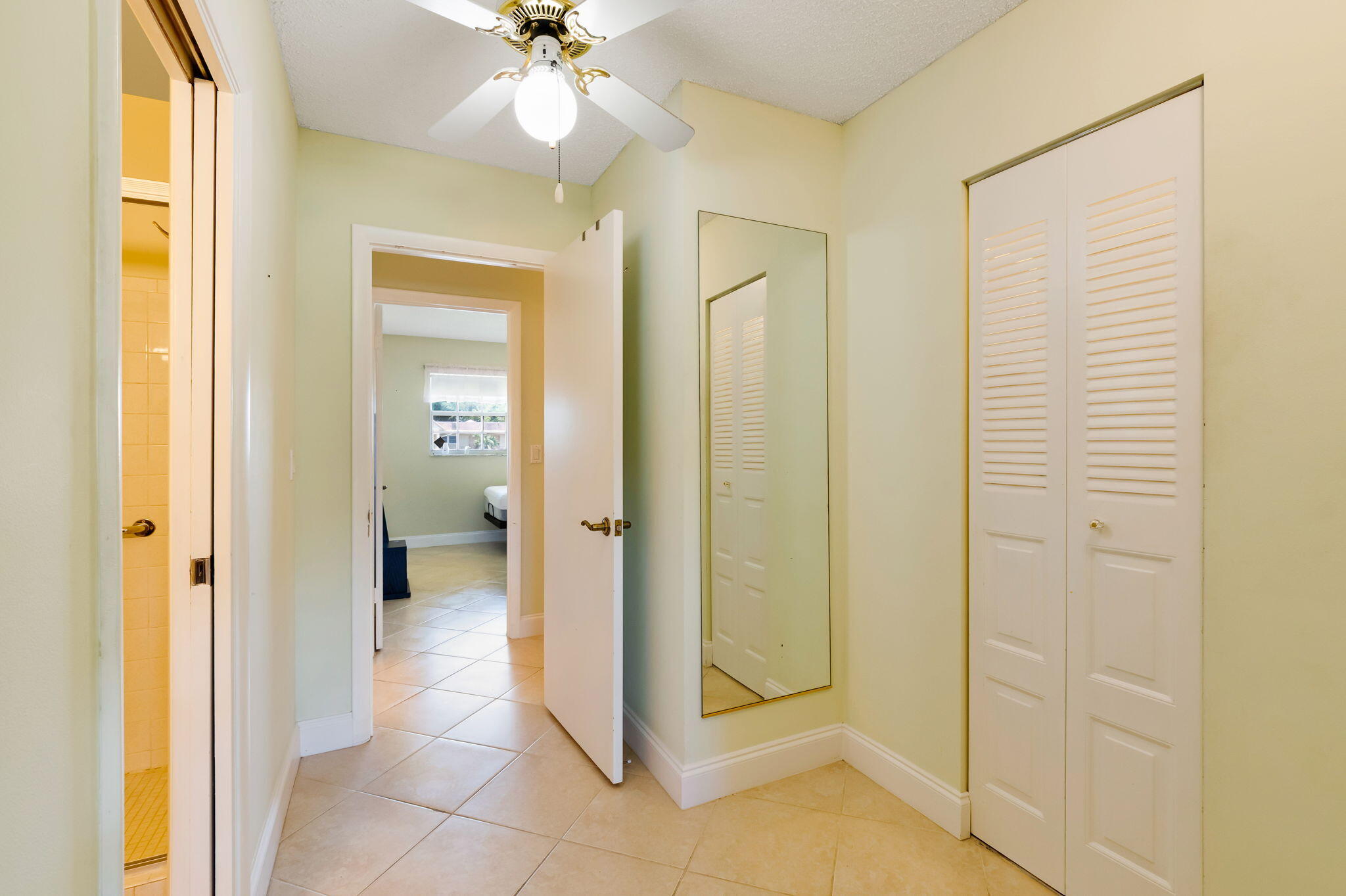 1700 Dover Road, Unit 204A Delray Beach, FL 33445 - Photo 16 of 33 a view of a bathroom with a glass door shower
