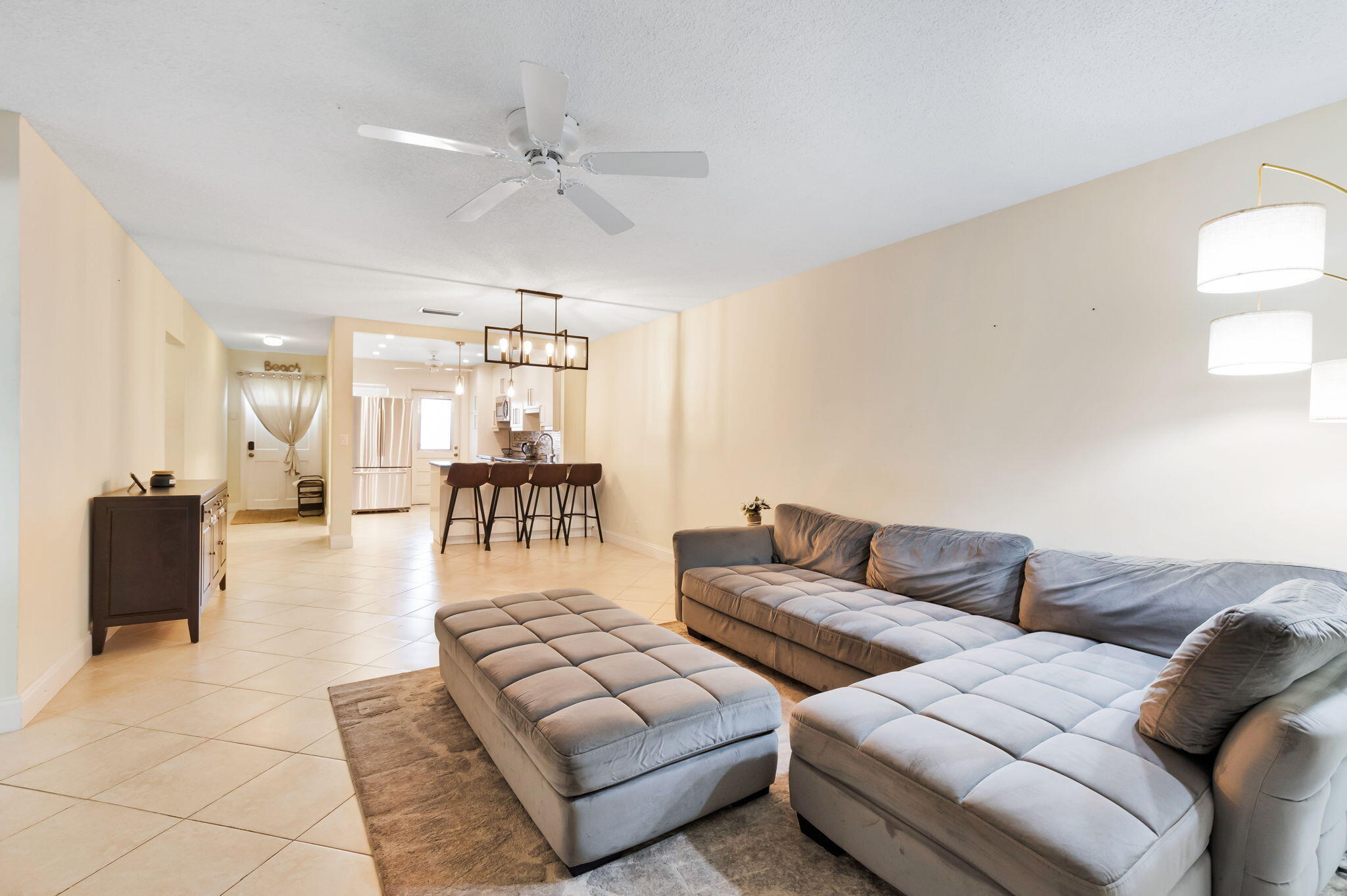 1700 Dover Road, Unit 204A Delray Beach, FL 33445 - Photo 23 of 33 a living room with furniture and a table