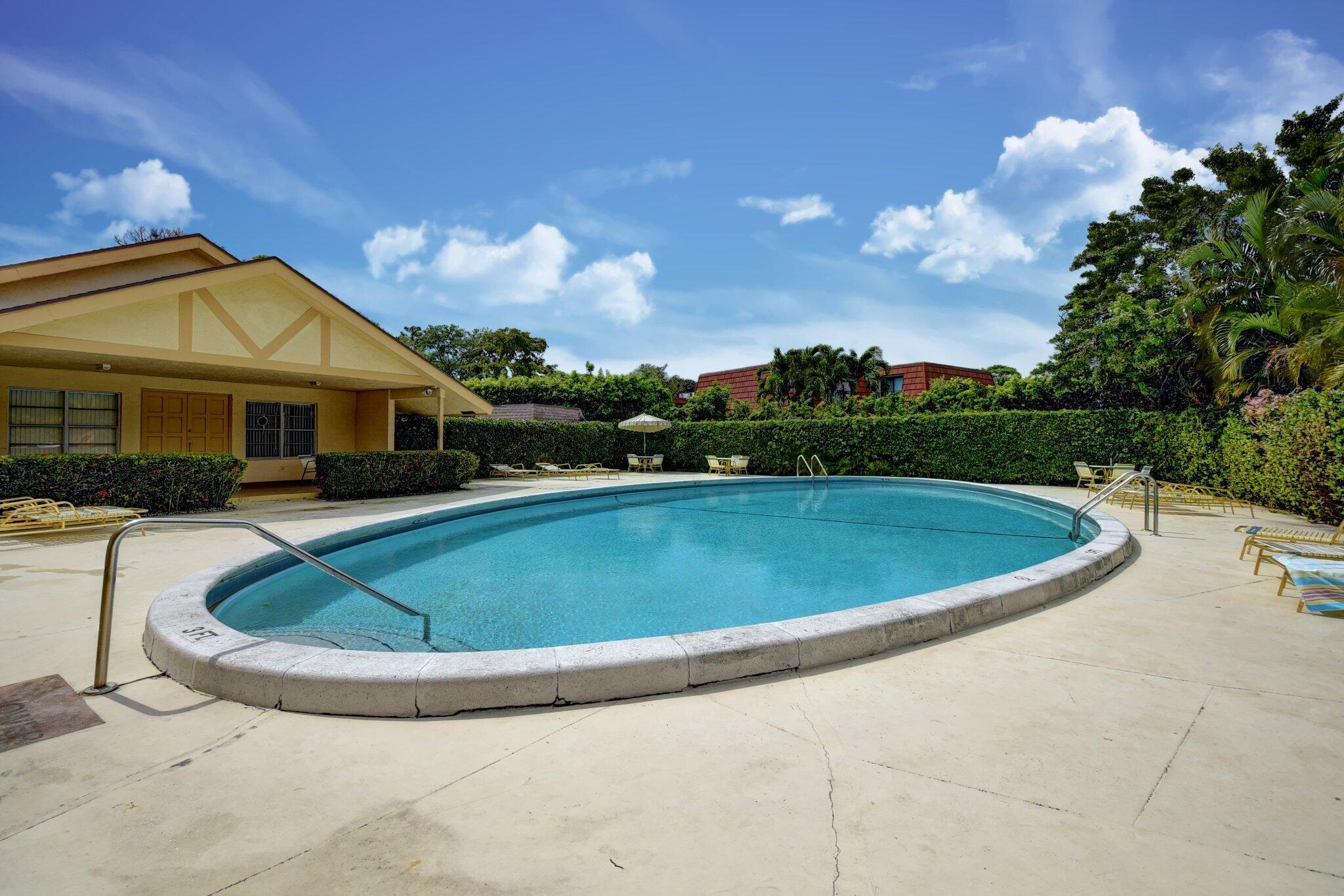 1700 Dover Road, Unit 204A Delray Beach, FL 33445 - Photo 32 of 33 a view of outdoor space yard and swimming pool