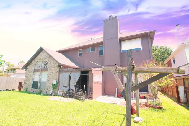 a view of a house with a swimming pool