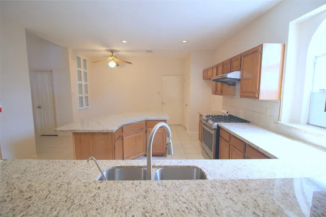 a kitchen with a sink and a refrigerator