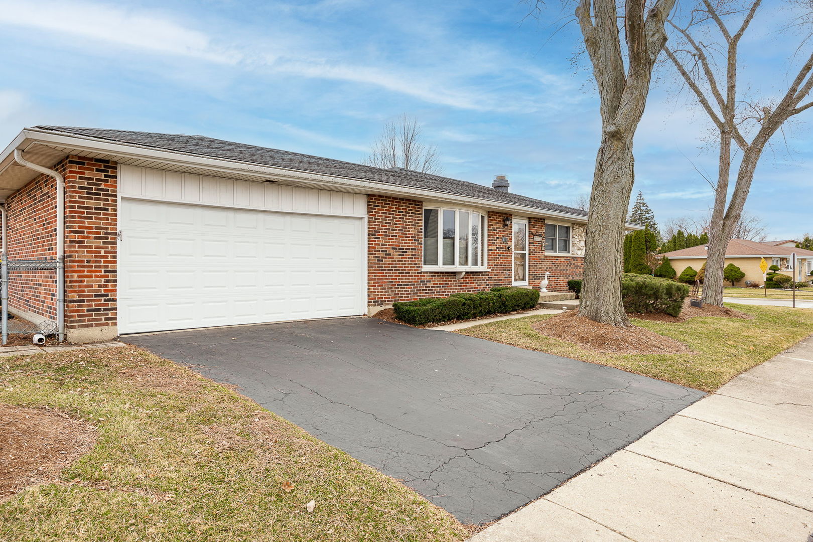 494 Flint Trail Carol Stream, IL 60188 - Photo 3 of 37 a front view of a house with a yard and garage