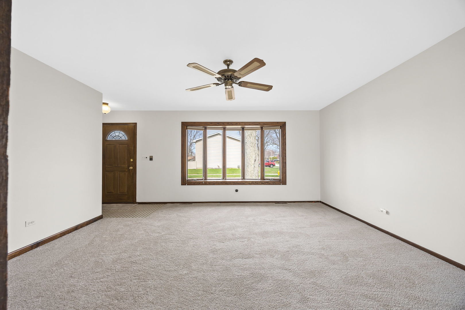 494 Flint Trail Carol Stream, IL 60188 - Photo 7 of 37 wooden floor in an empty room with a window