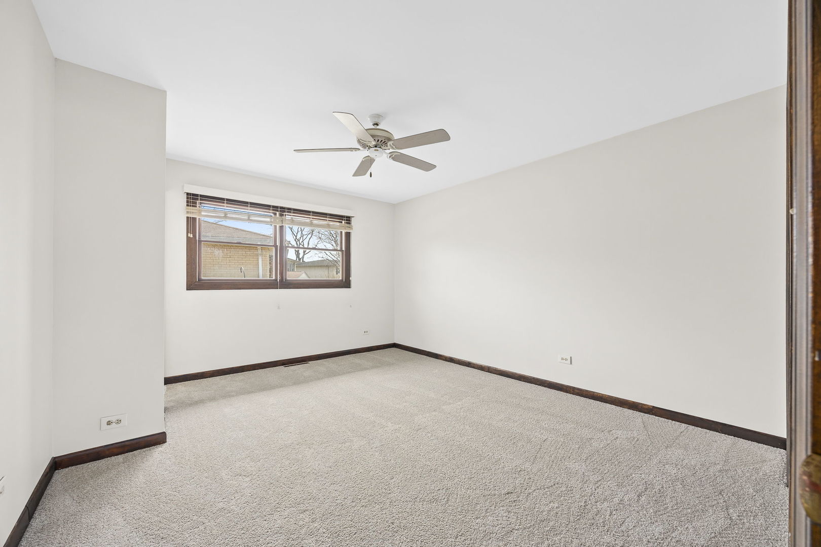 494 Flint Trail Carol Stream, IL 60188 - Photo 9 of 37 an empty room with windows and ceiling fan