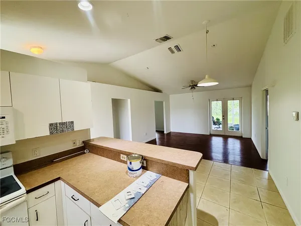 a living room with hard wood flooring and a table