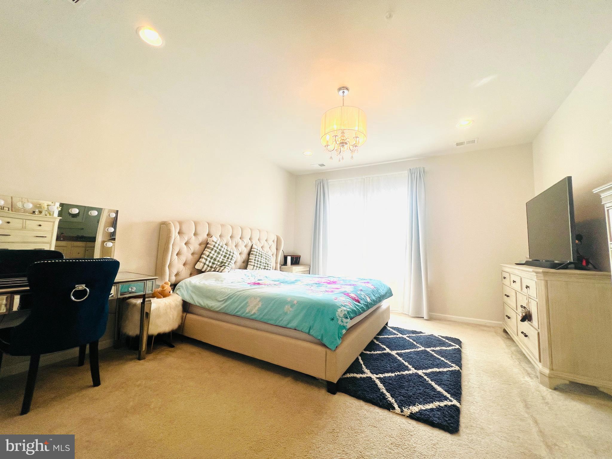 113 Patriots Path Malvern, PA 19355 - Photo 14 of 24 a bedroom with a bed and flat screen tv