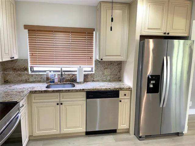a living room with granite countertop furniture and a window