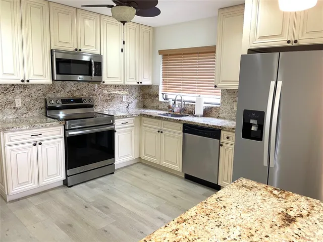 a bench sitting in a room next to a window