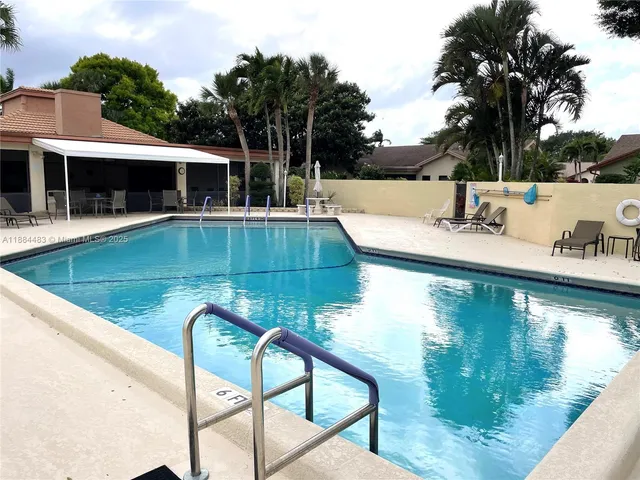 a view of a dining area with furniture and wooden floor