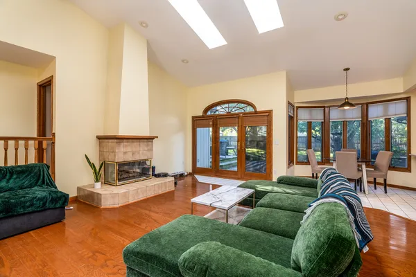 a living room with furniture and a fireplace