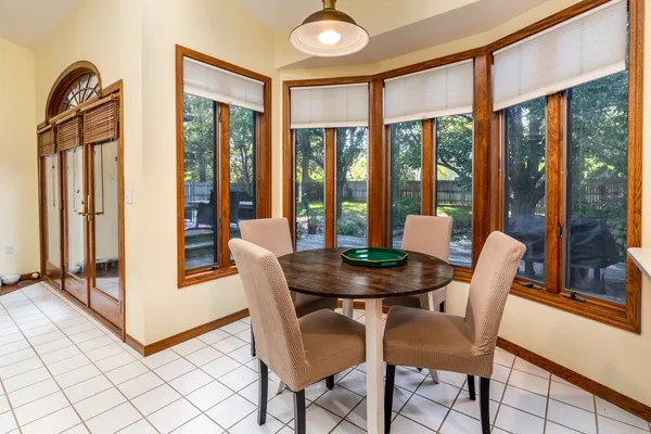a view of a dining room with furniture window and outside view