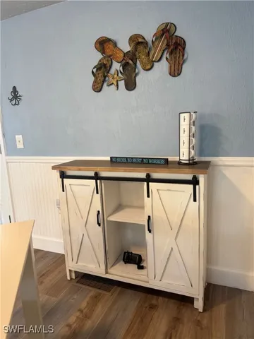 a view of an entryway with wooden floor